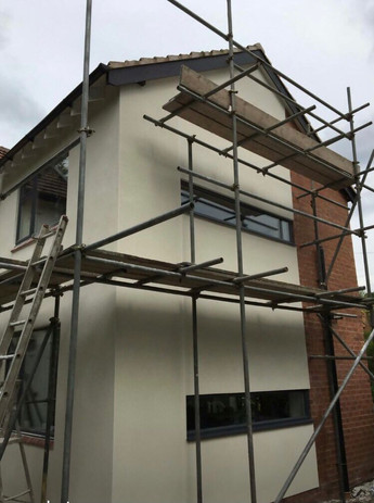 property with scaffolding up the side of it