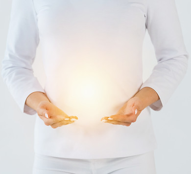 cropped view of healer standing and gesturing near light isolated on white .jpg