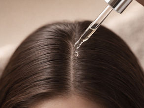 Close-up of healthy scalp with parted hair and serum dropper representing scalp care routine, hair health, follicle treatment, and skincare-inspired haircare trends.