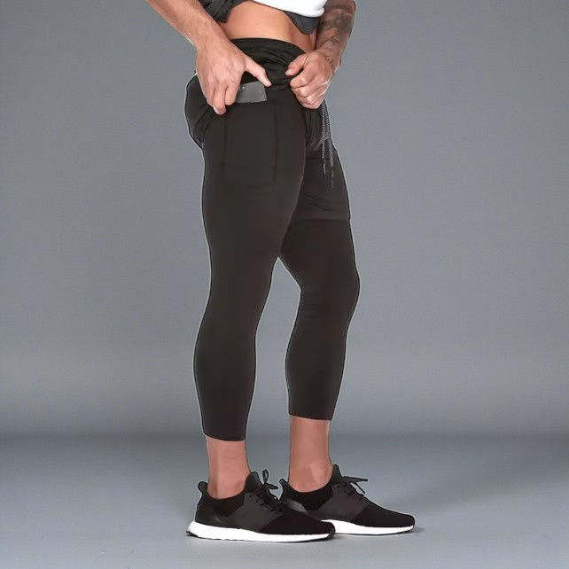 Men’s black RunCore 2-in-1 running pants by Casmir with quick-dry breathable eco-friendly fabric