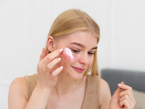 Beautiful young woman taking care of her skin