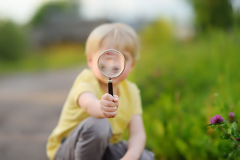 little-boy-playing-with-magnifying-glass.jpg