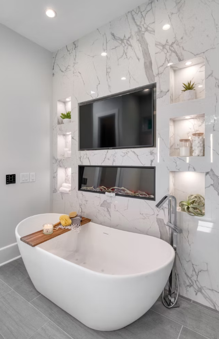 A stunning tub space in a high-end primary bathroom, designed by Tailored Designs for a Freedom Park, Carolina home. 