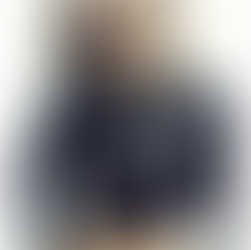 Woman in polka-dot leather jacket wearing Chanel sunglasses