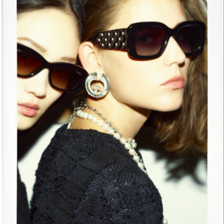 Two women wearing Chanel sunglasses