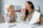 woman-doing-speech-therapy-with-a-little-blonde-boy-1.jpg