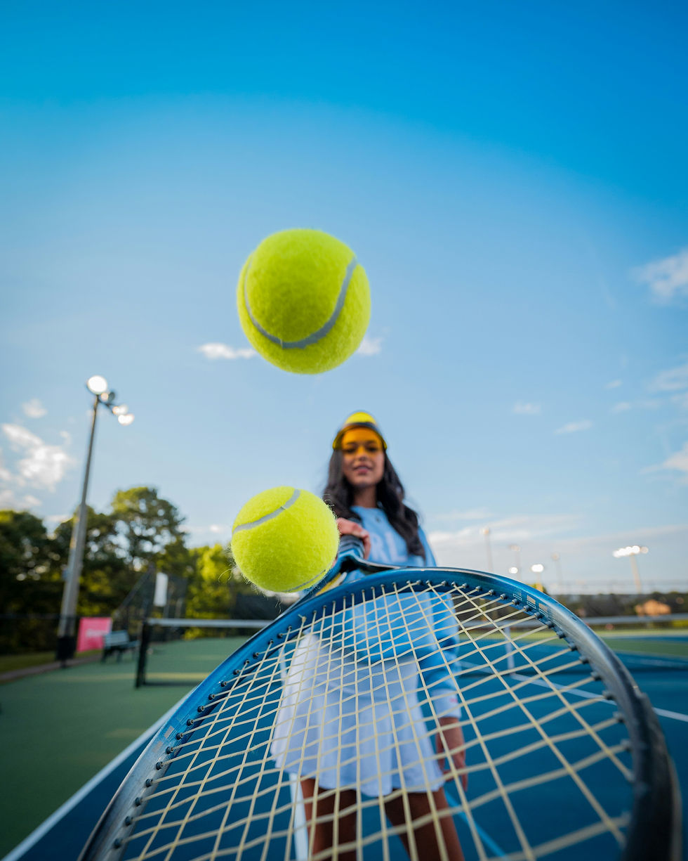 Tennis player with tennis balls and tennis racket