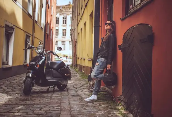 depositphotos_80962242-stock-photo-girl-posing-near-moto-scooter.jpg