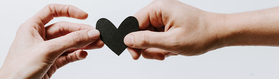 man and woman holding a heart together_e