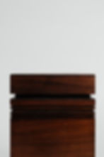Rear close-up of handcrafted solid walnut memorial urn with refined lines