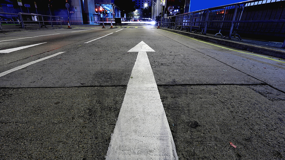 finding your why(s) - road at night with an arrow pointing forward