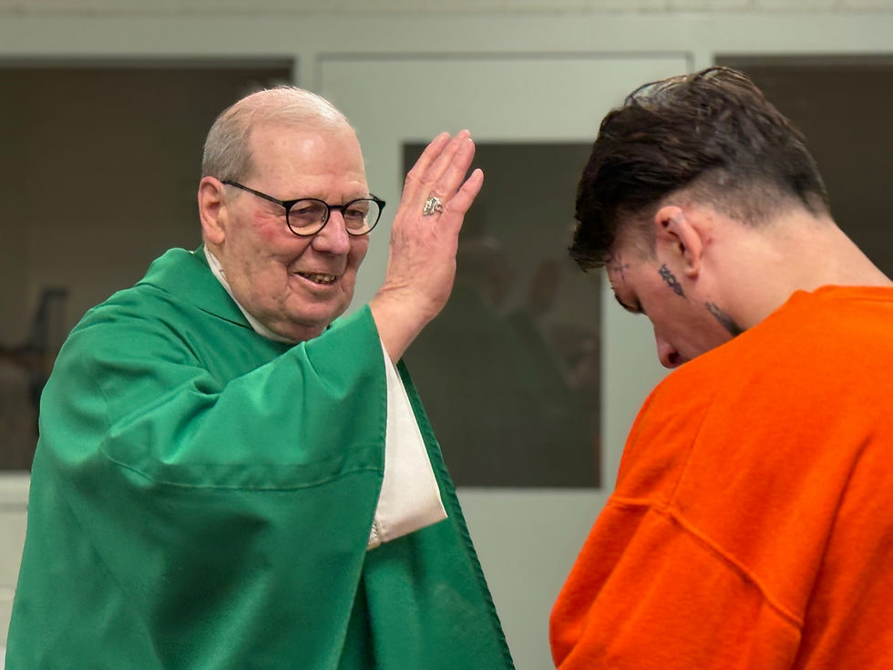 A York County Jail resident receives a blessing administered by Bishop Robert Deeley, who says Mass at the jail once a month for inmates who sign up to attend. While retired from administrative duties since 2024, he remains a priest and a Bishop, and says Mass weekdays in his home parish.