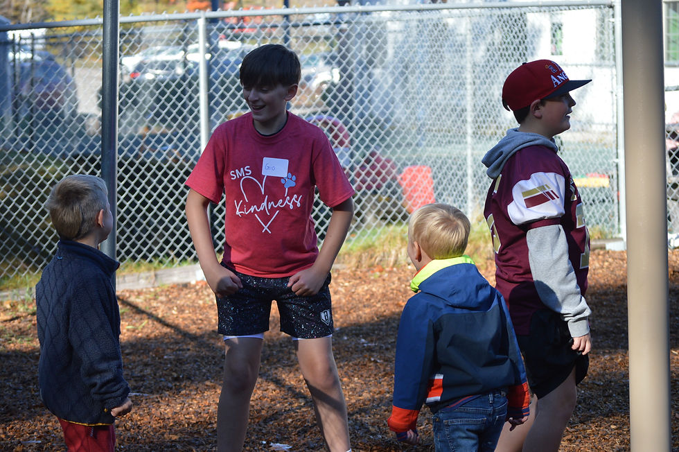 Saco Middle School sixth-grader Giovanni Davis and Colton Mercier spend the morning entertaining preschoolers at Saco PreK.