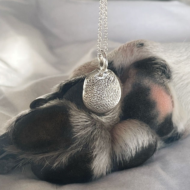 pawprint pendant necklace made with recycled sterling silver , handmade in salisbury
