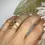 Thumbnail: Gold Wedding Band Textured With Your Own Beach Sand