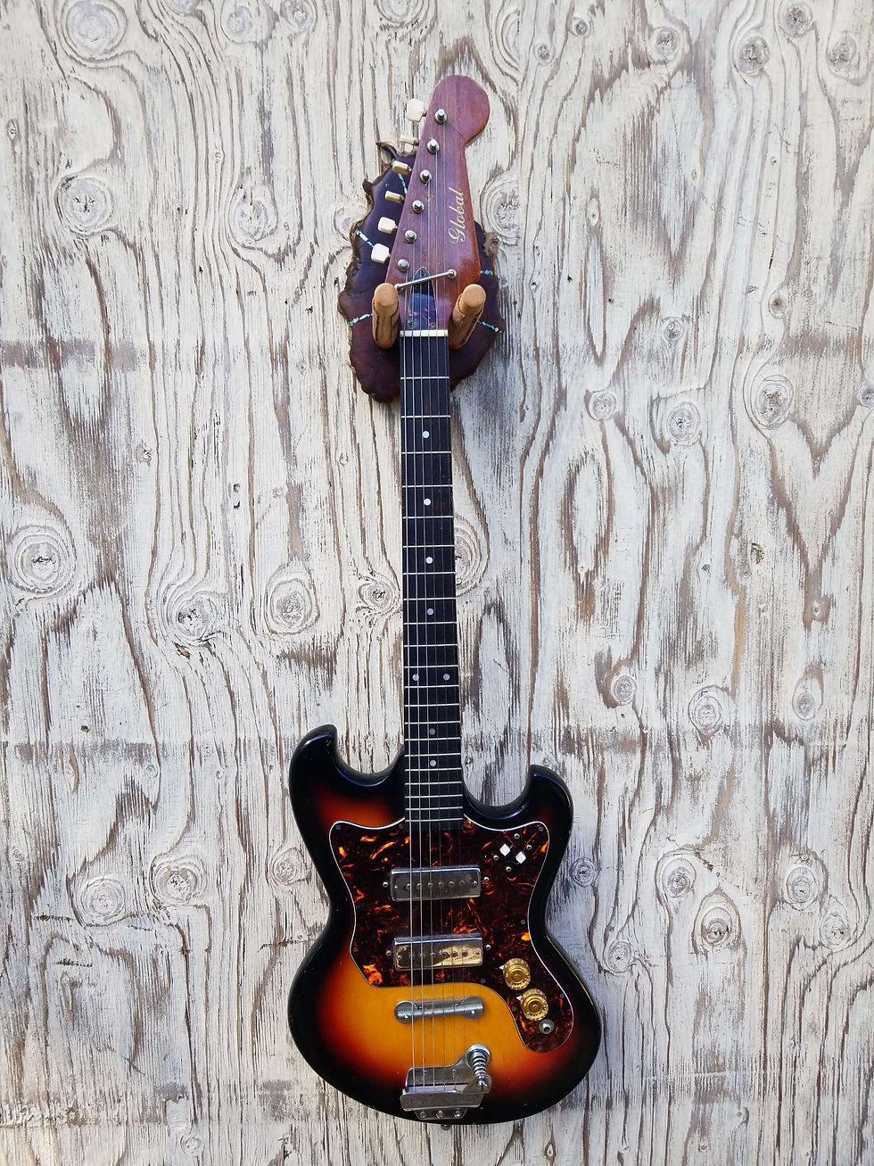 Thumbnail: Guitar Wall Hanger Live Edge Manzanita Burl with Bright  Blue Turquoise Inlay 