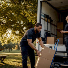 Labor only movers loading truck in suburban street