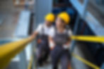 industrial-workers-engineers-walking-factory-climbing-metal-stairs.jpg