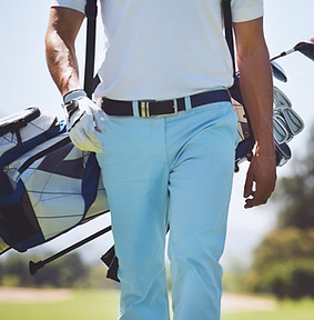 Man Carrying Golf Bag