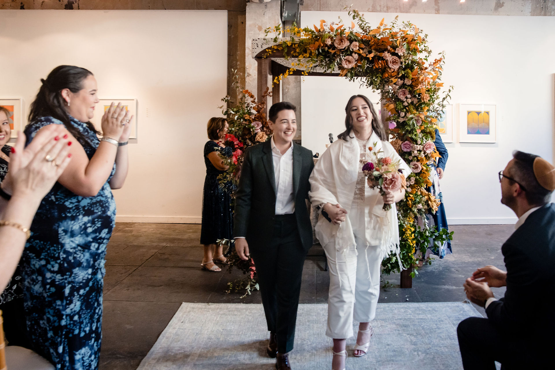 A queer couple at their wedding