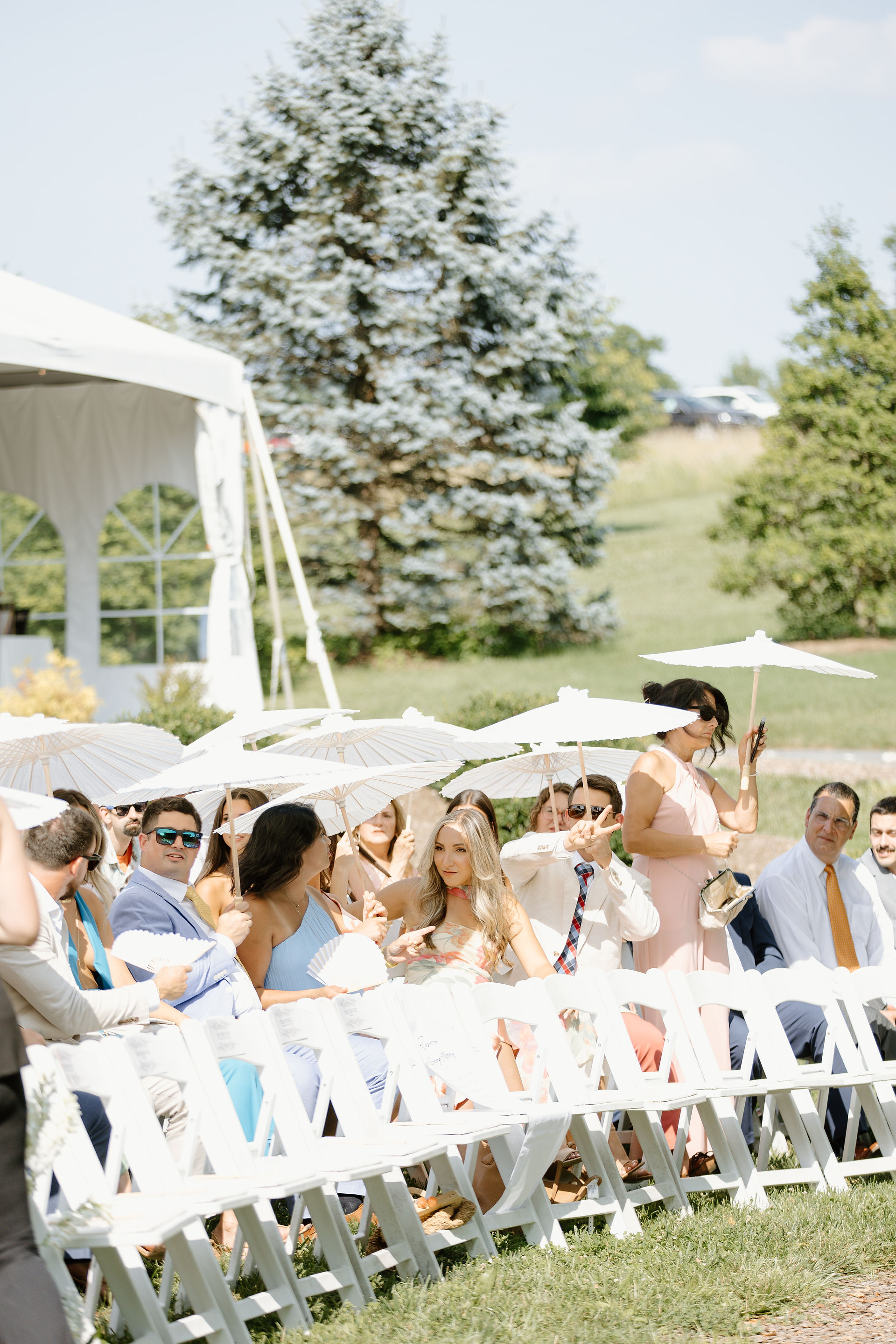 A sunny ceremony at Glen Ellen with guests holding parasols
