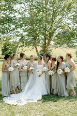 A bridal party posing for photos at Glen Ellen