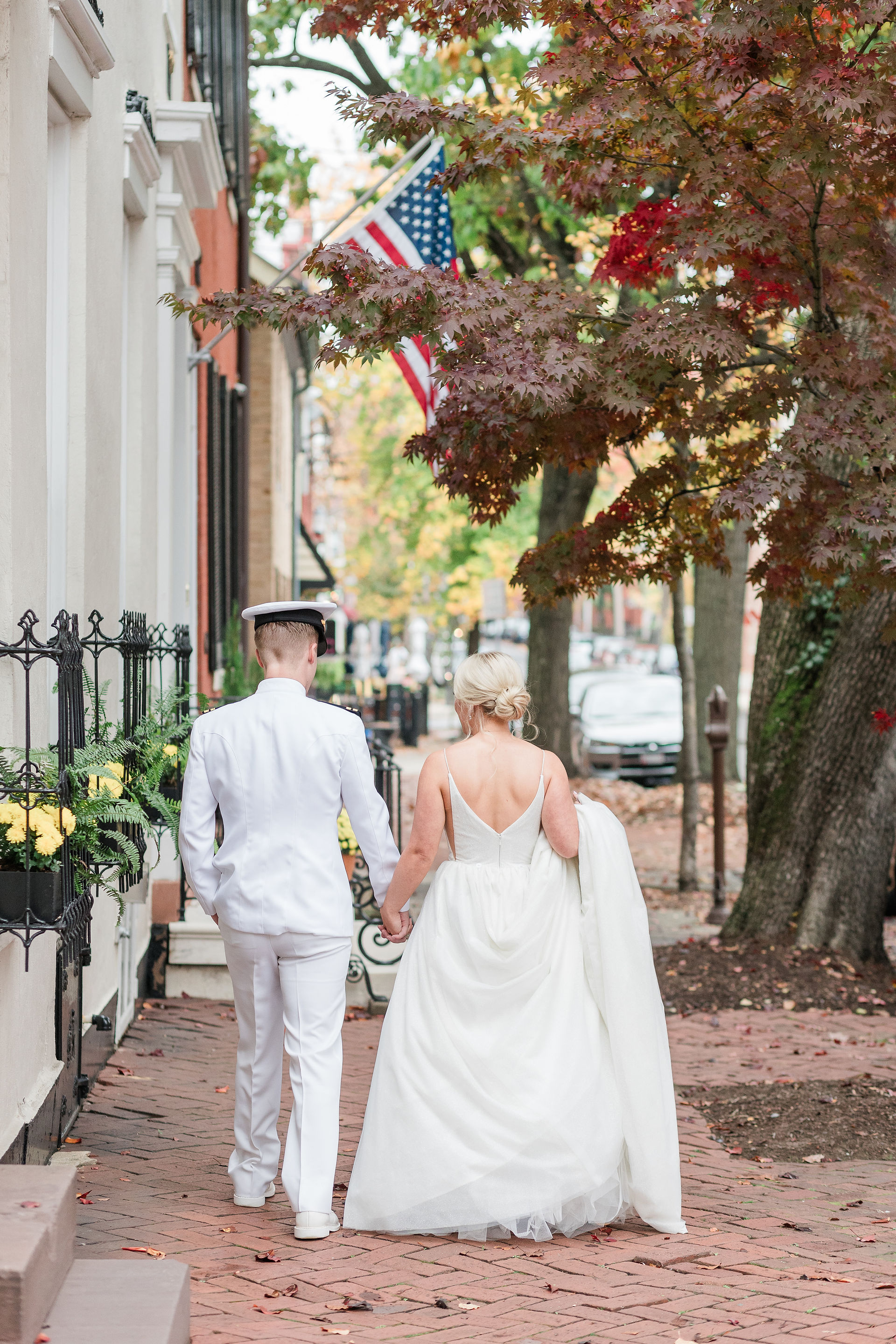 bride and groom walking down the streets of downtown frederick maryland