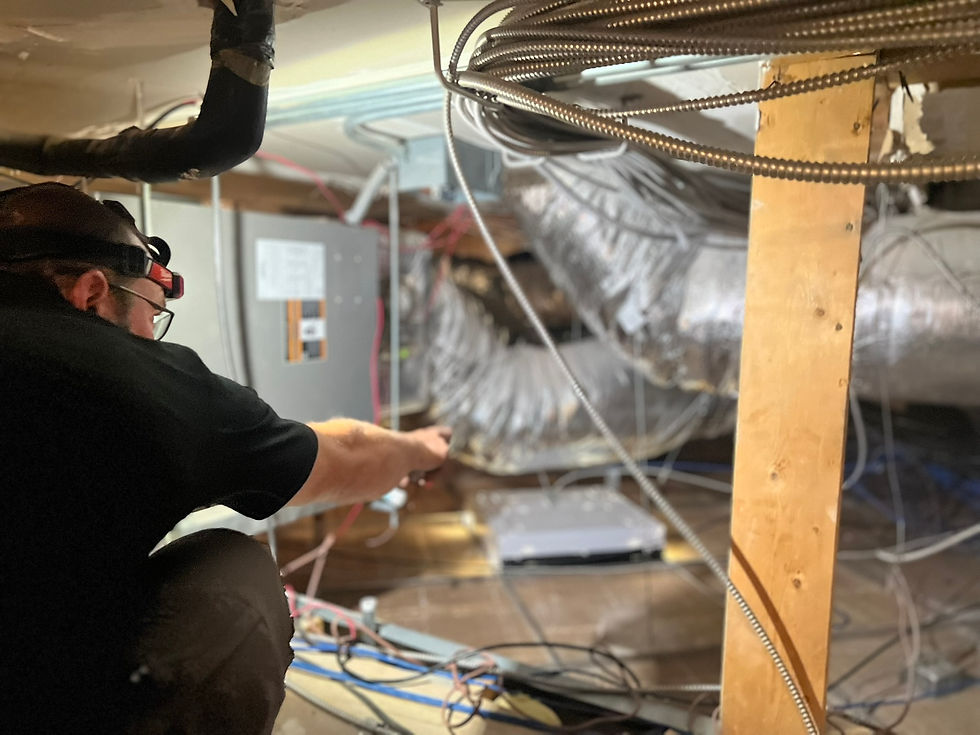 Close-up view of HVAC technician inspecting ductwork