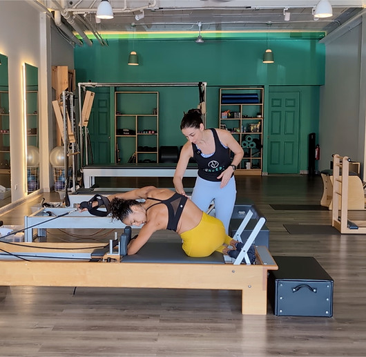 amy sasso pilates mentor teaching a teachers workout reformer pilates part of a workshop for teachers