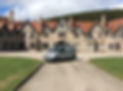 John Mutch van in front of a building