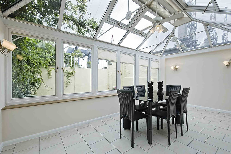 double glazed atrium with modern dining table.jpg