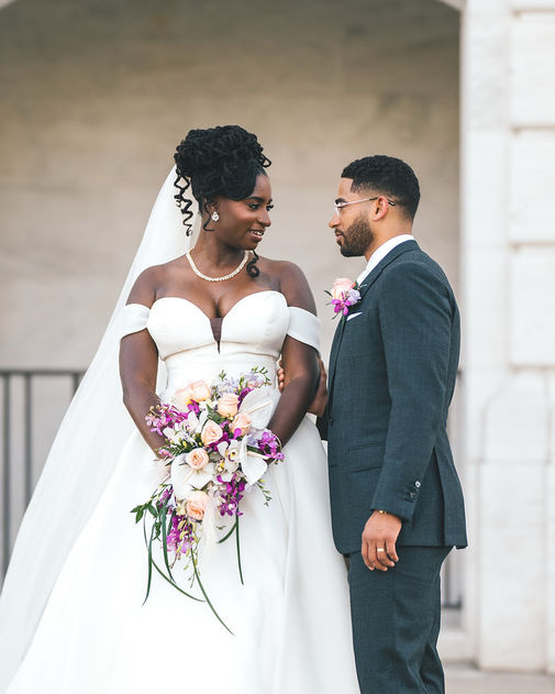 Bride & Groom standing in front of the historic DIA located in midtown Detroit