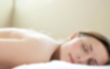 Woman relaxing during acupuncture treatment