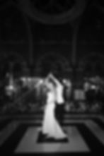 Couple Dance at Wedding Receptions at The St. Pancras Renaissance Hotel surrounded by White Wedding Flowers