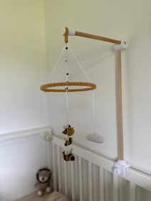 bumble bee baby mobil hanging over cot