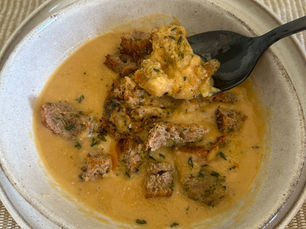 Turkish red lentil soup (mercimek çorbası) served with homemade croutons