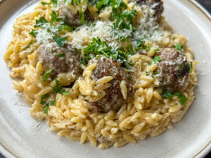 Creamy meatballs and orzo cooked in one-pan, served with chopped parsley and grated parmesan cheese