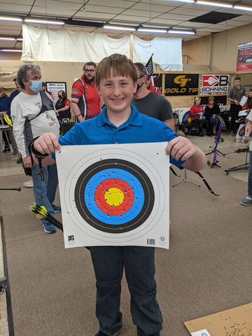 One of our students after shooting his very first tournament is all smiles.