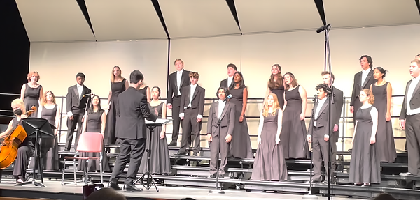 Strent conducts the premiere of "Songs for the People"