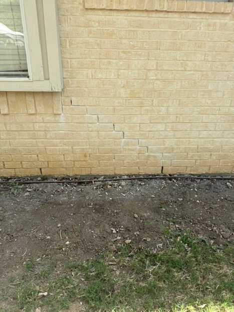 Exterior brick and mortar cracks before masonry repair in Aledo TX