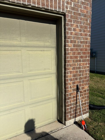 Garage door casing before replacement and exterior painting