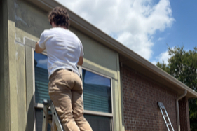 Damaged window casing and trim being replaced before exterior painting