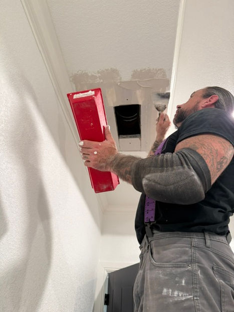 Applying joint compound during ceiling drywall repair