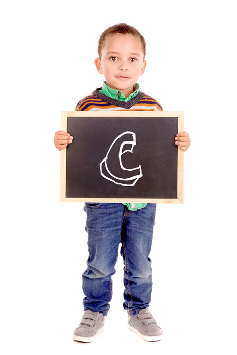Boy Holding C sign.jpeg