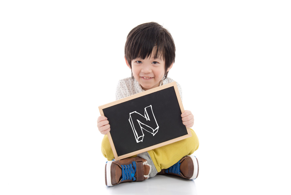 boy with N sign.jpeg