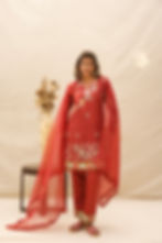 female model posing in rustic beauty by mukhtar sarees gul season 3 of color pale carmine and 100% giza cotton kurta/pant and checks organza dupatta 