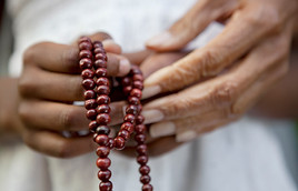 Hands Holding Beads