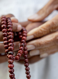 Hands Holding Beads