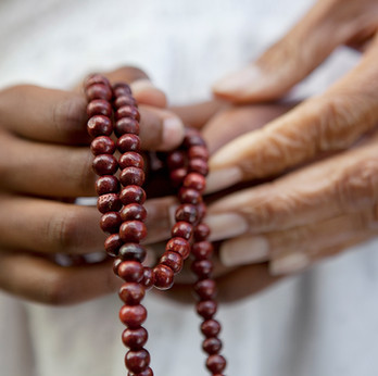 Hands Holding Beads