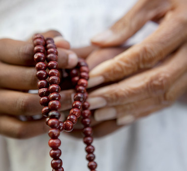 Hands Holding Beads
